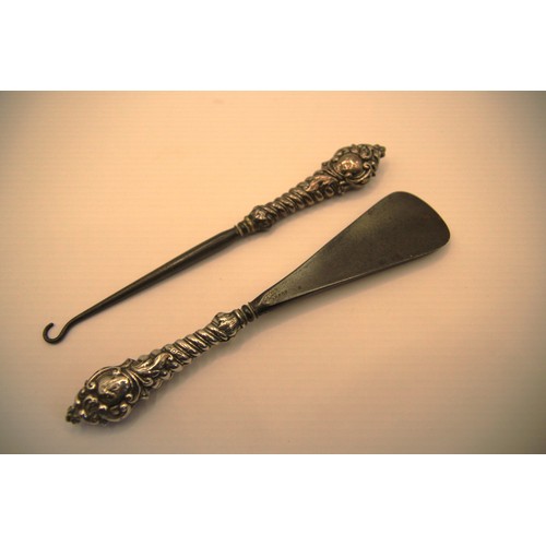 132 - A sterling silver handled shoe horn and button hook