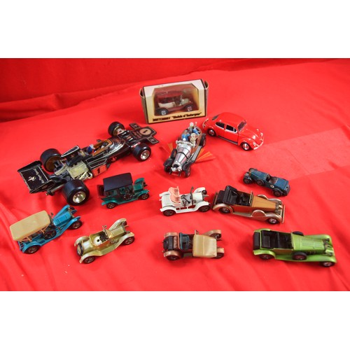 139 - An assortment of die-cast vehicles including a large Corgi JPS Formula 1 car, Corgi Chitty Chitty Ba... 