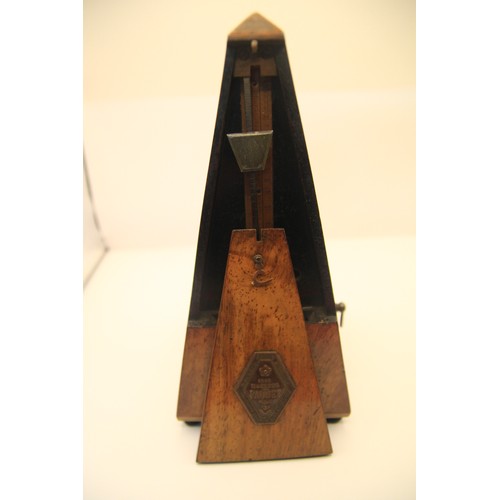 148 - A Malzeal Plaquet antique metronome in working order