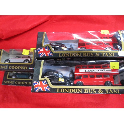 127 - Four Teamsters London Bus and London Taxi sets along with three BMW minis boxed 1.40 scale