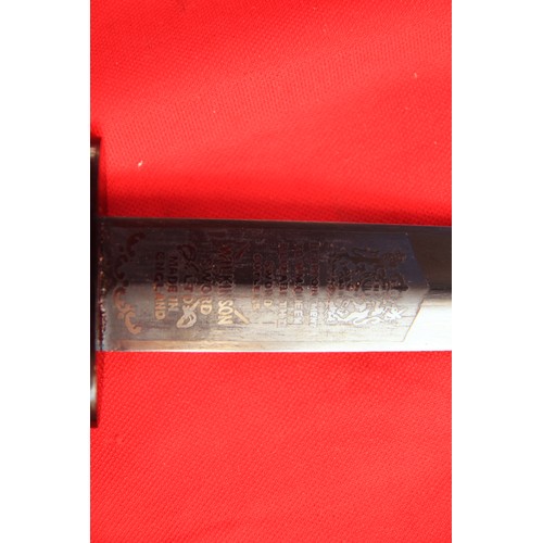 156 - A Fairbairn Sykes commando knife by Wilkinson Sword with black leather sheath, in very good conditio... 