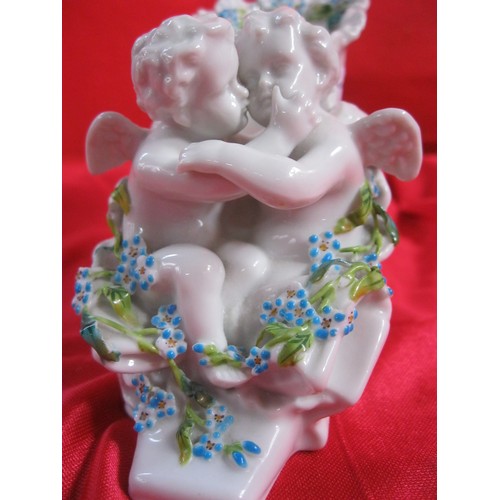 37 - Meissen style white porcelain shoe moulded with two cherubs and blue and green foliage, blue Augustu... 