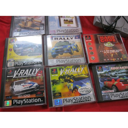 229 - A Sony Playstation 1 with a number of mainly driving games, 2 controllers, expansion unit and all ca... 