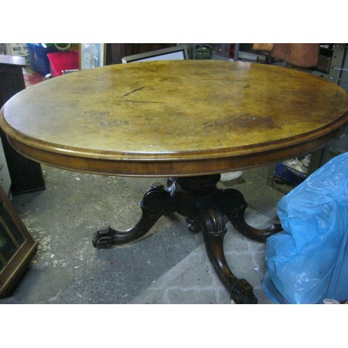 176 - A Victorian tilt-top dining table with walnut veneer top, in overall good order with some marks to t... 