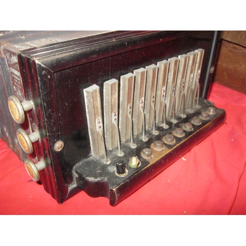 262 - An antique Tivoli Accordion in its original box, bellows good