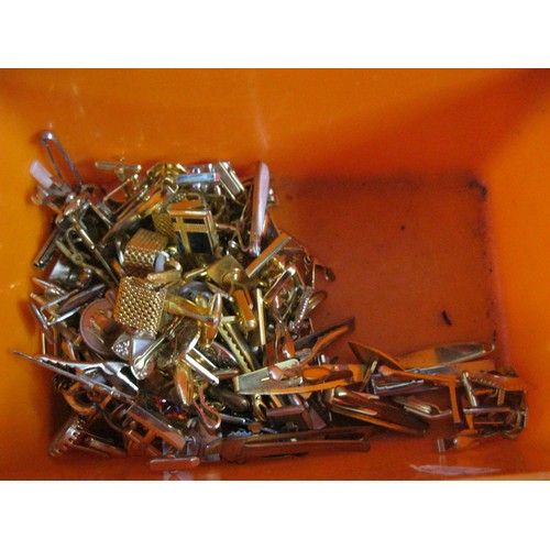 259 - A large tub full of vintage cuff links and tie-clips and -bars including ones shaped like aircraft, ... 