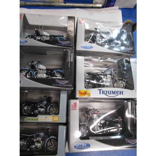 160 - A selection of motorcycles in 1.18 scale along with two smaller scale triumph motorcycles .Seven in ... 