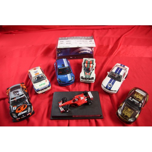 153 - Six slot cars by assorted manufacturers (some as found), a Mattel model of an F1-2000 car (not a slo... 