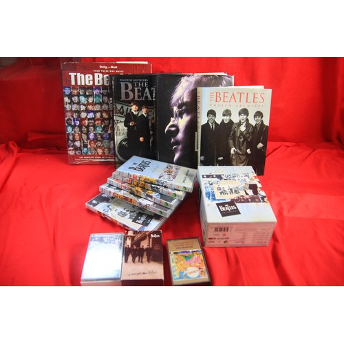 348 - An assortment of Beatles Memorabilia, including books, cassettes, and DVD's