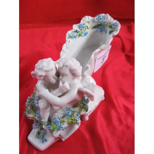 12 - Meissen style white porcelain shoe moulded with two cherubs and blue and green foliage, blue Augustu... 