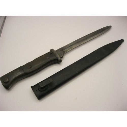 23 - A German bayonet in scabbard, cut down into a fighting knife