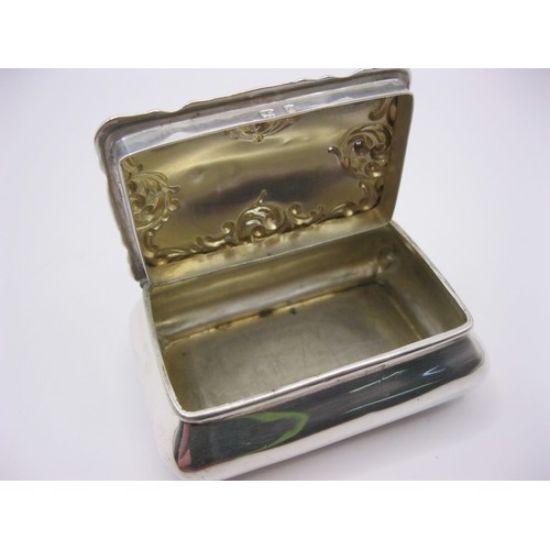 108 - A sterling silver snuff or trinket box with decoration to cover, of substantial size, hallmarked for... 