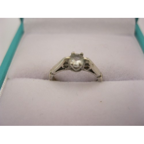 124 - An 18 carat gold solitaire diamond baby's ring, size A/B, approx weight 1g