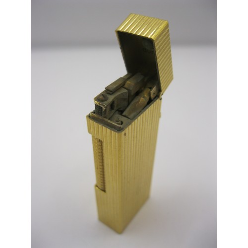 142 - A vintage gold-plated Dunhill cigarette lighter