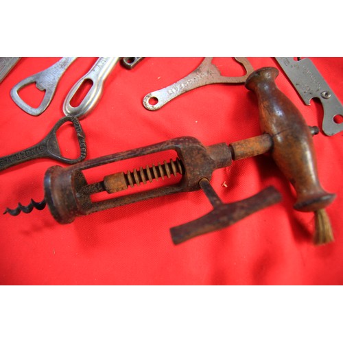 31 - An antique mechanical wooden-handled cockscrew with brush, plus a number of vintage and antique bott... 