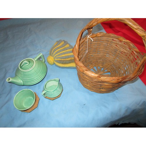 104 - Child`s tea set in a basket along with a teacosy and baby walker which has a full load of multicolou... 