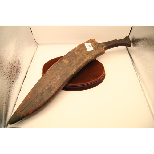 24 - A WW1 military Mark II Gurkha Kukri in original leather-covered wooden scabbard, stamped for maker D... 