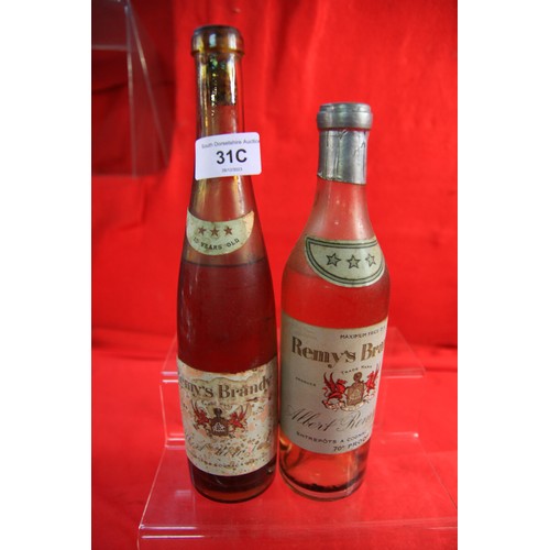 31C - 2 vintage bottles of Remy's Brandy, one marked 'maximum price 21/6' and 70 degrees proof, both bottl... 