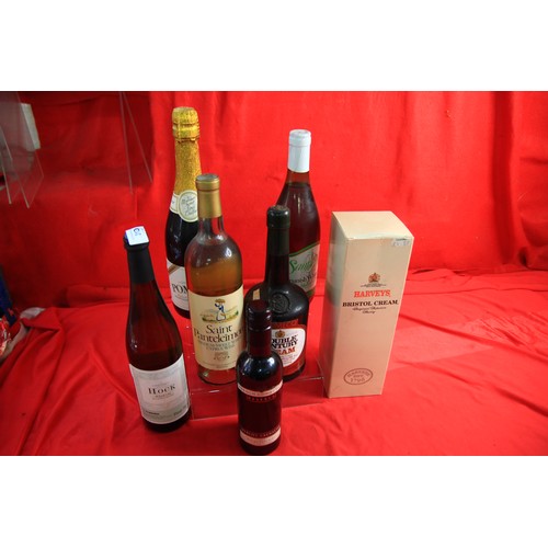 31D - A small assortment of vintage bottles of wine and sherry including double century cream, pomagne and... 