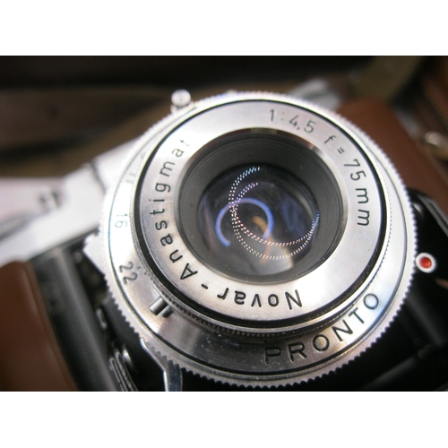 15 - A Zeiss Ikon folding camera and accessories in a photographic case, in very good order