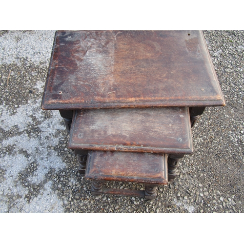 18 - A lovely set of angled coffee tables with some age in a dark heavy wood.