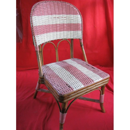 375 - A vintage musical rattan doll's or child's chair, the music mechanism working