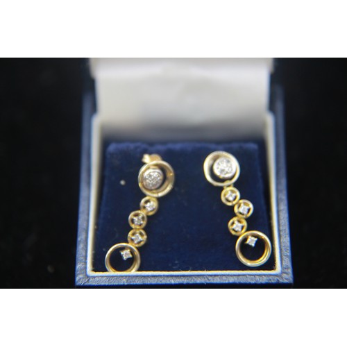 80 - A stunning pair of 9 carat gold and diamond drop earrings of particularly unusual design featuring 8... 