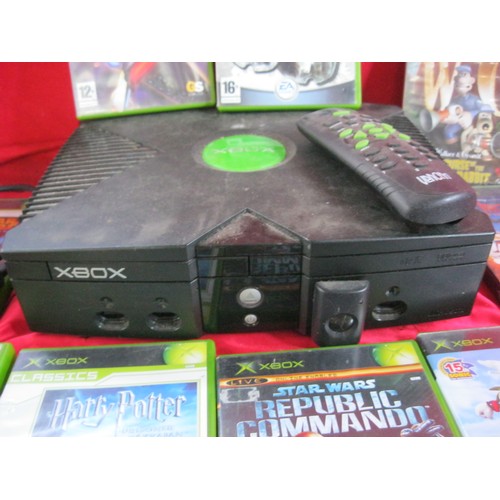 56 - An original Microsoft X Box (some cables, no controllers) with a selection of games