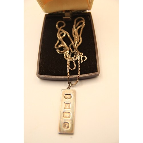 24 - A 1 ounce sterling silver ingot on a sterling silver chain, in good order, hallmarked for Birmingham... 