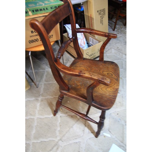 90 - An antique rustic chair in good order, shows signs of past use and repeated repair