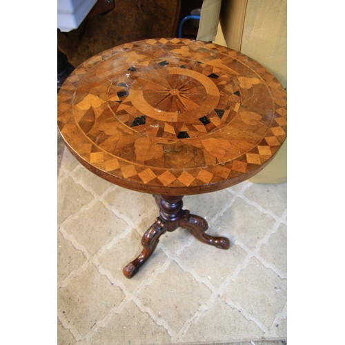91 - An ornately inlaid table of some age, in good order, on tripod feet under a turned pedestal