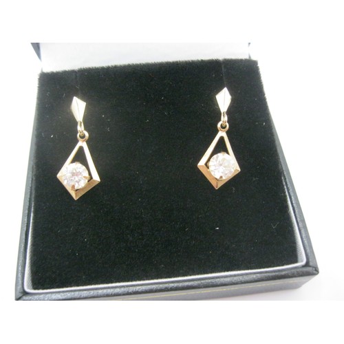 96 - A pair of 9 carat gold and clear stone earrings