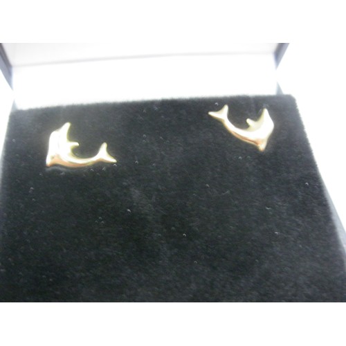 97 - A pair of 9 carat gold earrings in the form of dolphins