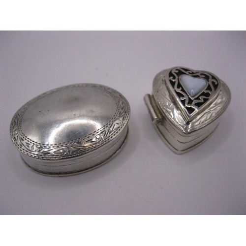 102 - A pair of snuff- or pill-boxes in sterling silver, one heart-shaped with white heart-shaped stone to... 