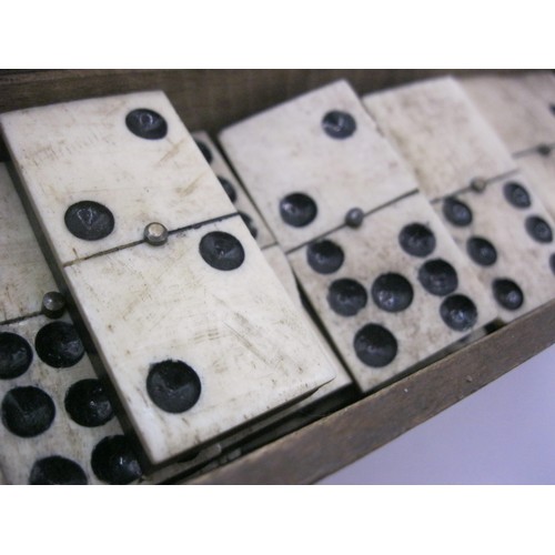 112 - A boxed set of 19th century bone and ebony dominos in POW style, a complete set of double 9s, 55 in ... 