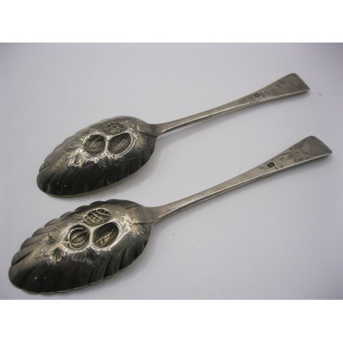 151 - A pair of ornate embossed silver berry pattern serving spoons hallmarked for London 1782, approx wei... 