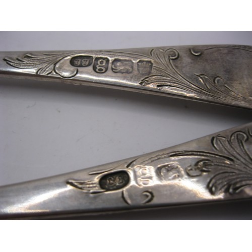 151 - A pair of ornate embossed silver berry pattern serving spoons hallmarked for London 1782, approx wei... 