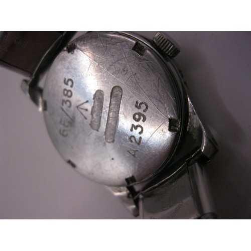 156 - A steel military wristwatch engraved to rear with broad arrow 6E/385 A2395, in running order (not ch... 