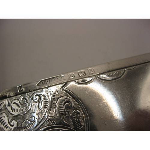 163 - A sterling silver calling card case with floral decoration and blank cartouche, hallmarked for Birmi... 