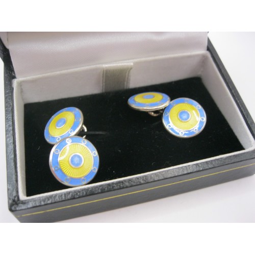 178 - A pair of hallmarked silver and bi-coloured enamel cufflinks by K.K. McDonough