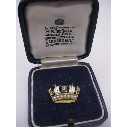 185 - A 9 carat gold and enamel pearl set naval crown sweetheart brooch in a Garrard & Co box, approx weig... 