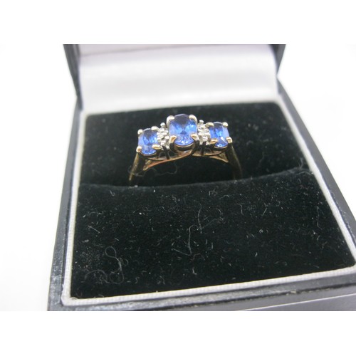 211 - A 10 carat gold blue stone ring marked TNL, approx weight 2.1g, size N/O