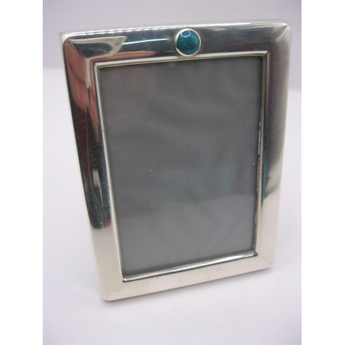 221 - A Liberty & Co small silver photo frame with green enamel decoration, hallmarked for Sheffield 1988