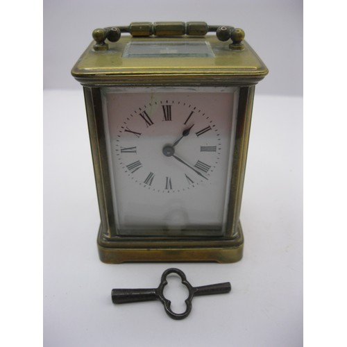 240 - A small brass carriage clock timepiece