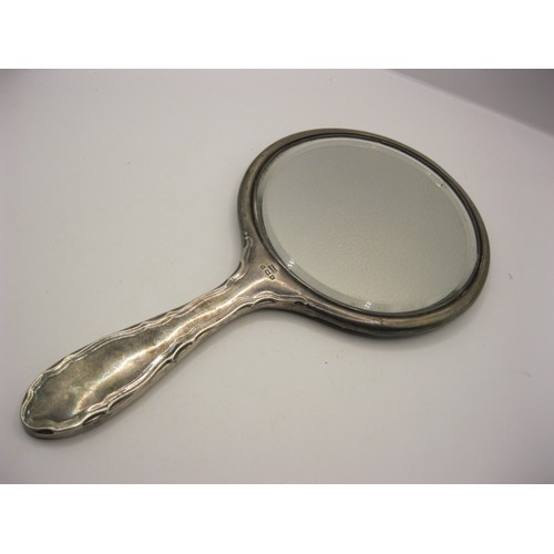 249 - A silver and tortoiseshell hand mirror with pique inlaid decoration hallmarked for Birmingham 1918 b... 