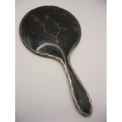 249 - A silver and tortoiseshell hand mirror with pique inlaid decoration hallmarked for Birmingham 1918 b... 