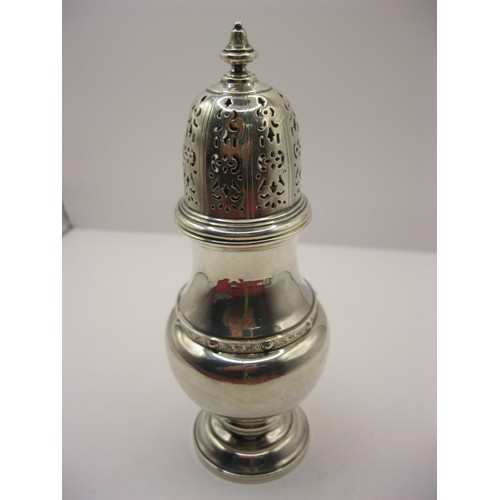 253 - A large sterling silver sugar castor with ornate pierced top and a celtic pattern band to waist, hal... 