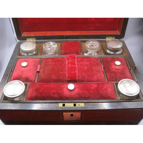 116 - A Victorian rosewood work box with velvet fitted interior, various jars and bottles and having a jew... 