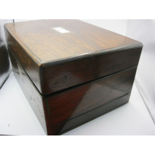 116 - A Victorian rosewood work box with velvet fitted interior, various jars and bottles and having a jew... 