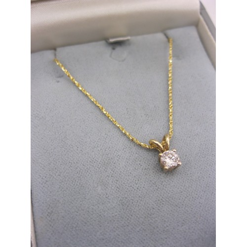 362 - A 9 carat gold chain and pendant set with a 0.4 carat diamond